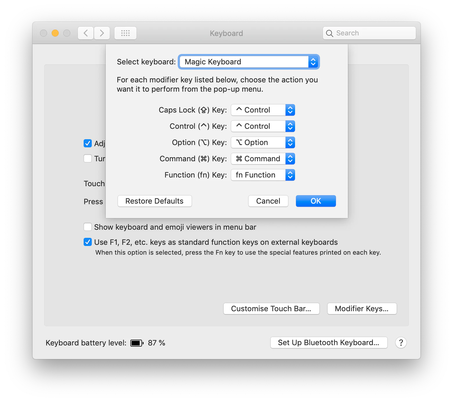 screenshot of macOS keyboard settings dialog where Caps Lock is remapped to Control